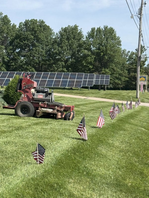 Toro commercial mower on a diamond-striped lawn